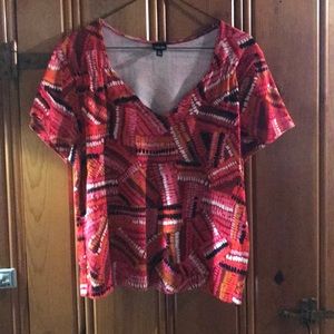 T shirt. Multi colored red, pink, black & white.